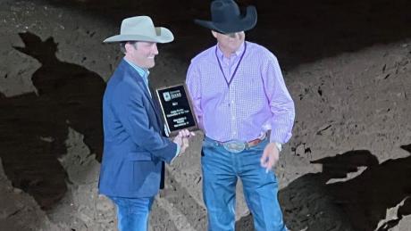 San Angelo Stock Show and Rodeo Assoc. Director Justin Jonas (left) receives the award for "Best Large Rodeo" from the Waco rodeo association president and CEO Wes Allison at the Waco rodeo performance on Oct. 13, 2022.