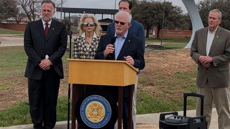 Chamber President Walt Koenig, Mayor Brenda Gunter, Congressman August Pfluger (back), banker Mike Boyd at podium and County Judge Steve Floyd.