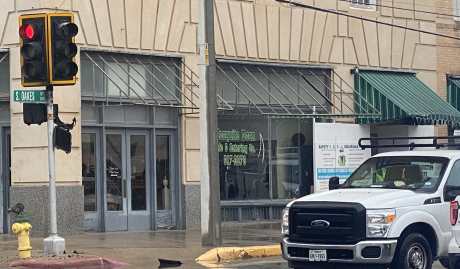 A crosswalk sign on Thursday morning melted in front of the historic Cactus Hotel just steps away from its fabric awning. 