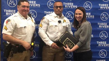 Mental Health Sergeant Quentin Williams and Corporal Chris Roque (left and center) receive award.