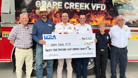 An LCRA representative presents a $24,820 grant to the Grape Creek Volunteer Fire Department for new self-contained breathing equipment for firefighters. The grant is part of LCRA’s Community Development Partnership Program. Pictured, from left to right, are: Rick Bacon, Tom Green County commissioner, Precinct 3; Cooper Hogg, LCRA Regional Affairs representative; José Rivera, deputy fire chief; Aaron Flint, fire chief; Lauren Fortier, VFD treasurer; and Joe Rutherford, captain.