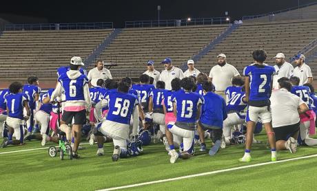 Coach Guevara talks to his team after loss to Andrews