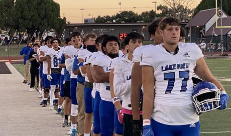 Lake View lines up for the National Anthem before taking on the Brownwood Lions at Gordon Wood Stadium