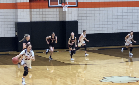 Kailey Freemen drives the ball down the court.