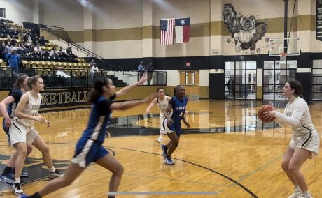 The Central Lady Cats (wearing Clyde uniforms) in action against Fort Worth Boswell
