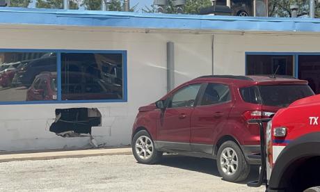 A vehicle crashed into a laundromat Thursday afternoon, leaving a hole in the building.