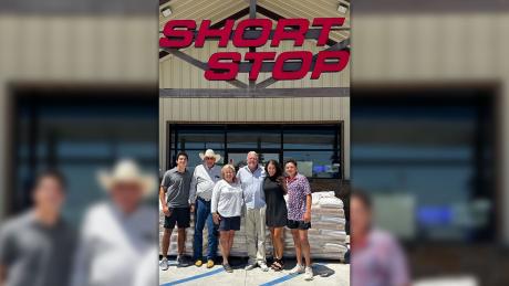 Pictured with Short Stop's Charlie Reichenau, Linda, and Clint are Clint's wife Brittany and their two sons Gage and Ian. 