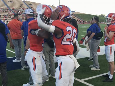 Central quarterback Christian English and running back Elijah Allen celebrate after a touchdown against Belton at San Angelo Stadium on Friday, Sept. 20, 2024.