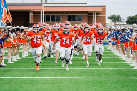 The Central Bobcats charge onto the field before their game against Abilene High on Friday, Aug. 30, 2024, at San Angelo Stadium.