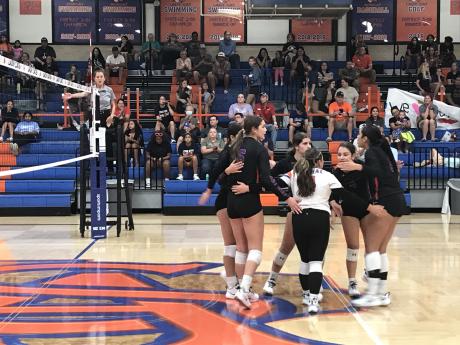 The Central High School volleyball team talk after a point against Clyde on Tuesday, Sept. 17, 2024.