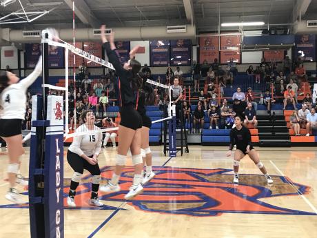 The Central volleyball team goes for a block against Clyde on Tuesday, Sept. 17, 2024.