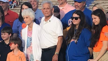 Mr. Manuel Gonzales is with his wife, Amanda, and surrounded by his children and grandchildren for the presentation of his high school diploma.