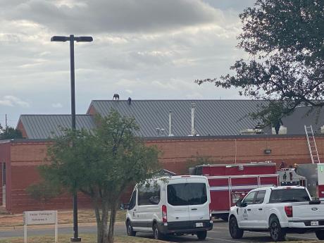 Law enforcement officers on the roof of River Crest Hospital during a special call response in San Angelo, TX.