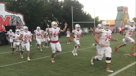 The Miles Bulldogs run out of the tunnel before their game against Albany on Friday, Oct. 11, 2024.