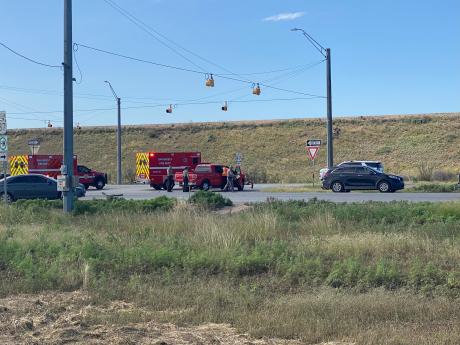 Emergency responders from the San Angelo Fire Department and Texas DPS assess the scene at US-87 and FM 2105 following a two-vehicle crash on Monday morning. (Photo by San Angelo LIVE!)