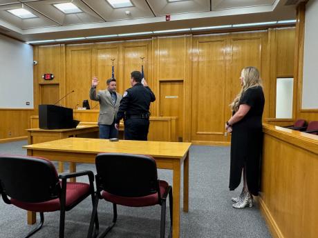 San Angelo Police Chief Travis Griffith administers the oath of office to Israel Bilbo as Bilbo's wife, Deyna, looks on. Bilbo joined the police force on Nov. 1, 2024.
