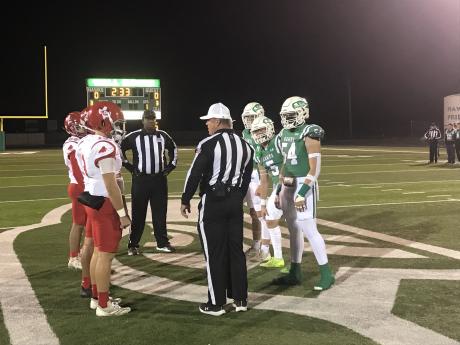 The captains for Wall and Stanton met at midfield for the coin toss Friday, Nov. 8, 2024.