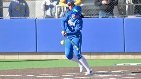 Angelo State's Carter Smith makes contact during a softball game in the 2025 season.