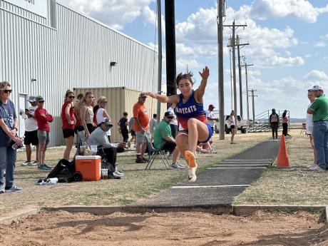 Athletes compete in the triple jump Wednesday at the Cotton Patch Relays in Wall.