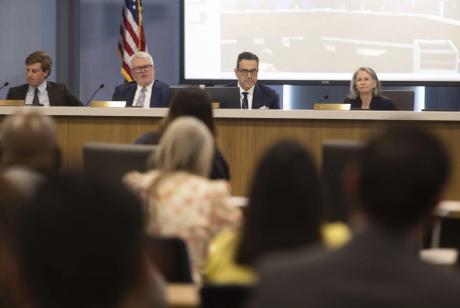 Members of the Texas Lottery Commission sit at the front of the room during a Texas Lottery Commission meeting on April 29, 2025.