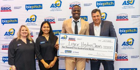 (L-R) SBDC Director Dezaray Johnson, Inglai Hangaripaii (SBDC grad student), Eugene Liger III, NVCOB Dean Dr. Andrew Tiger. 