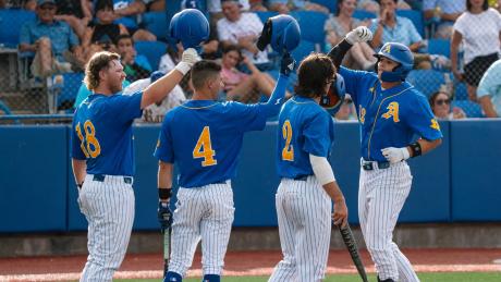 Tayten Tredaway, Austin Beck, Chase Pendley and Lane Hutchinson celebrate during the Angelo State baseball team's win over Lubbock Christian on Thursday at the NCAA Division II South Central Regional Tournament.