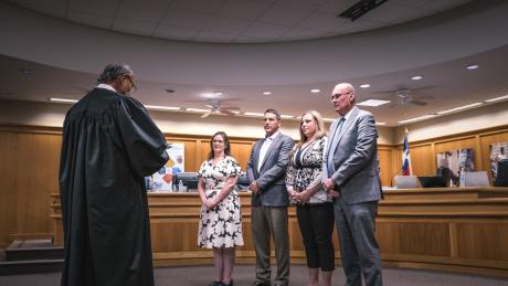 Judge Gonzalo Rios administers the oath of office to newly elected and returning San Angelo ISD trustees, from left: Ami Mizell-Flint, Dr. Taylor Kingman, Karla Cardenas, and Bill Dendle, during the May 19, 2025, board meeting.