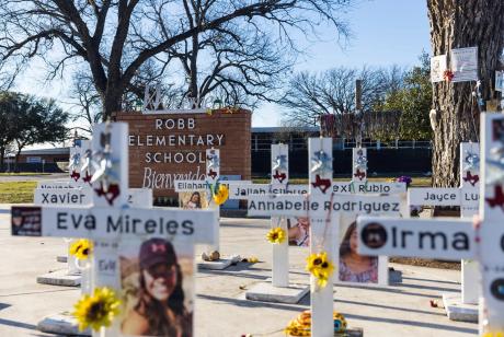 Memorial crosses are seen in 2024 outside Uvalde's Robb Elementary School, where 19 students and two teachers were killed two years earlier.