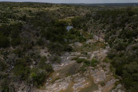 Texas Parks and Wildlife Department biologists and staff take part in an aquatic sampling survey at Yancey Creek, which runs through what will be Post Oak Ridge State Park.