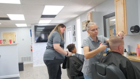 Hair stylists work at Kickin Kuts, a new barber shop on Sherwood Way.