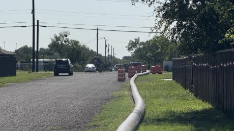 Flooding on San Angelo’s Short Street left at least one home accessible only by boat, as city crews work to pump water and officials warn against unapproved water relocation.