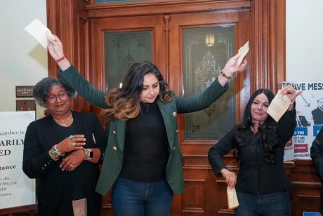 State Rep. Mihaela Plesa, D-Plano, rips up her "permission slip" in front of the Texas House, vowing she will stay the night in the House Chamber in support of fellow Democrat Nicole Collier on August 19, 2025. At left is Rep. Rhetta Bowers, D-Garland, at right is Rep. Cassandra Garcia Hernandez, D-Farmer's Branch.