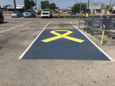 Tanya Burwick, who was killed during the July 4 flooding in San Angelo, had her favorite parking spot memorialized at the Walmart where she worked. 