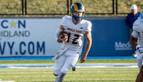 Angelo State quarterback Braeden Fuller runs for yardage against Fort Hays State on Thursday, Aug. 28, 2025.