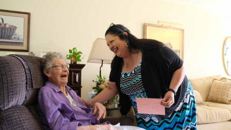 Ida Walter, seated, shares a laugh with Norma Dietz Lee, executive director of Meals for the Elderly, during Walter’s 101st birthday celebration Friday in San Angelo.