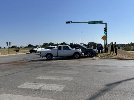 A crash at the intersection of Knickerbocker Road and a Loop 306 frontage road snarled traffic Wednesday afternoon.