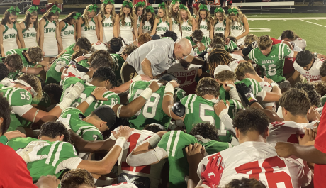 Wall Hawk Head Coach Craig Slaughter leads the teams in prayer