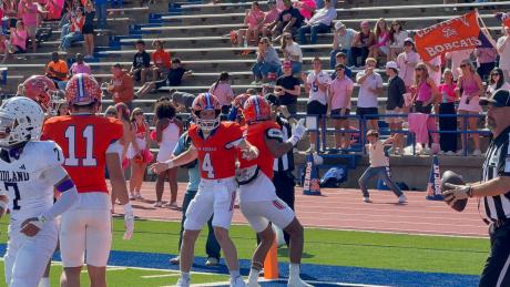 Central quarterback Micah Smith (4) celebrates with wide receiver Gabriel Garcia (1) after a touchdown pass against Midland High on Saturday, Oct. 25, 2025.