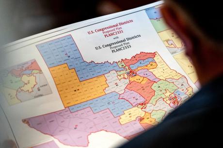 State Rep. Matt Morgan, R-Richmond, surveys a map of proposed new congressional districts in Texas, as Democratic lawmakers, who left the state to deny Republicans the opportunity to redraw the state's 38 congressional districts, began returning to the Texas Capitol in Austin on Aug. 20, 2025.