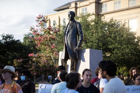 Texas A&M University students gather around the statue of former university President Lawrence Sullivan Ross for a protest in defense of academic freedom on Sept. 22, 2025. Texas A&M University System regents on Thursday will vote on a policy that would prohibit faculty from teaching "race and gender ideology." 