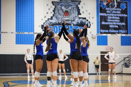 The Northwest Nelson volleyball team celebrates a point during the 2025 season.