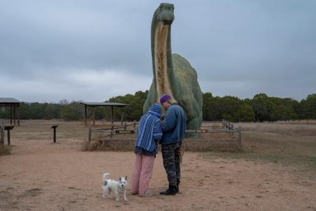 Nicholas Hanson and Haley Write of Austin with their dog Beans at Dinosaur Valley State Park on Nov. 7, 2025. A proposed transmission line could be visible from the park.