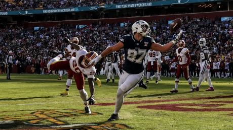 Dallas Cowboys' Jake Ferguson catches a touchdown pass against the Washington Commanders