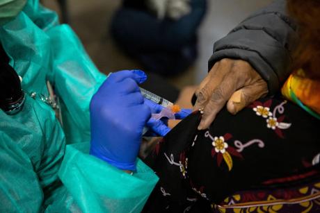 Bessie Bell, 96, receives her first dose of the COVID-19 vaccine at Fair Park, Dallas County's public vaccination site, on Jan. 11, 2021.