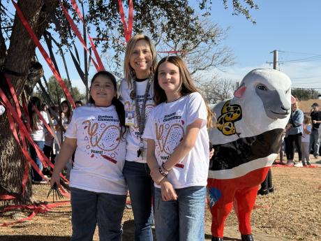 The students pictured designed the shirts being worn for the event. 