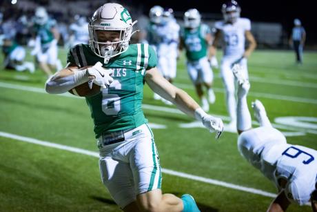 Wall running back Brady Neal gains yardage in the Hawks' 2025 season opener against Mason.