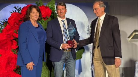 Justin Jonas (center) flanked by Jean Ann LeGrand and Bob LeGrand