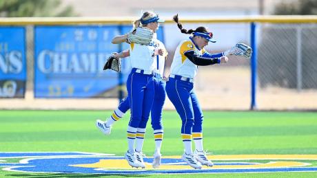 Kamren Loeffler, Karli Manney and Tatiana Trotter celebrate during the Angelo State softball team's home-opening tournament during the 2026 season.