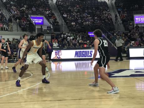 Water Valley's Branson Lacy dribbles against the defense of Munday's Jariyis Williams in their regional final game Friday, March 6, 2026.