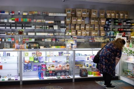 A customer browses products at Austin Vape & Smoke in Austin.